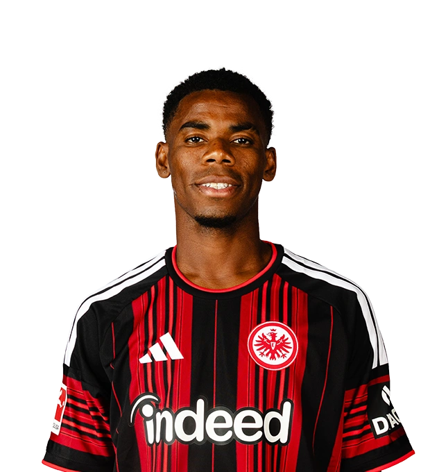 Kurze schwarze Haare und ein schmaler Kinnbart prägen den leicht lächelnden Mann im Eintracht Frankfurt Trikot.